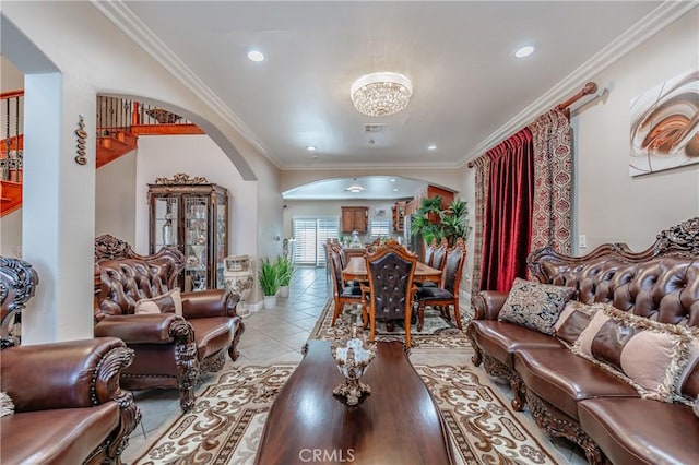 living room featuring light tile patterned floors and crown molding