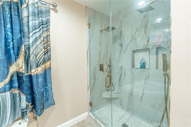 bathroom featuring tile patterned flooring and a shower with shower door