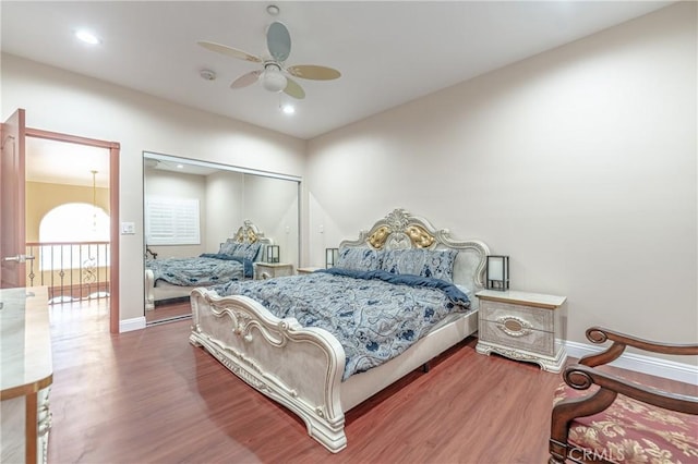 bedroom with hardwood / wood-style flooring and ceiling fan