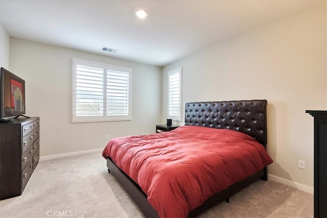 bedroom with light carpet