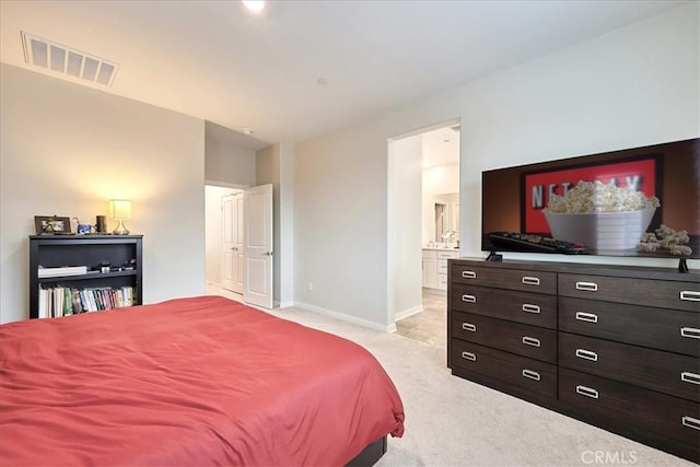 carpeted bedroom with ensuite bathroom