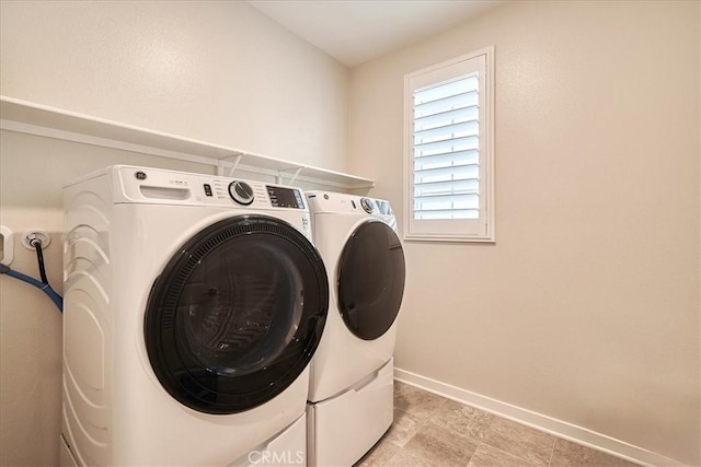 washroom with washer and clothes dryer