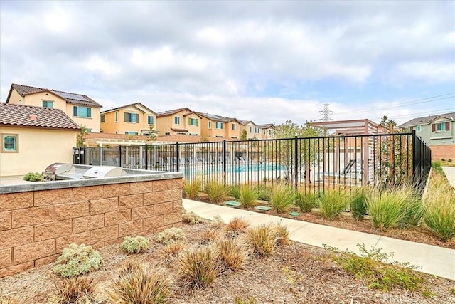 view of swimming pool with area for grilling