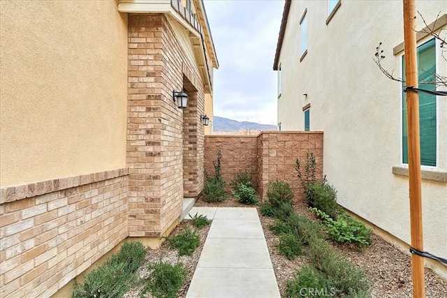 view of side of home with a mountain view