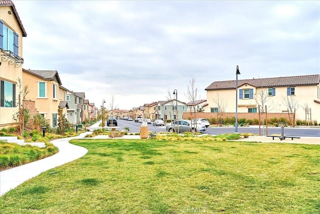 view of home's community featuring a yard