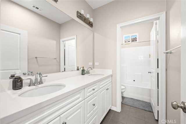 full bathroom featuring tub / shower combination, tile patterned floors, vanity, and toilet