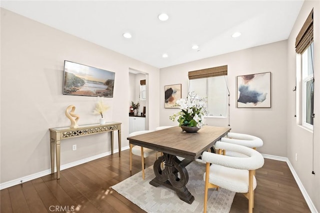 dining room with dark hardwood / wood-style flooring