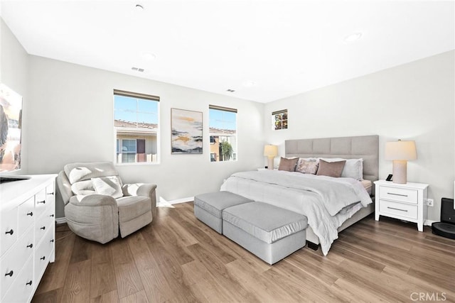 bedroom with hardwood / wood-style flooring