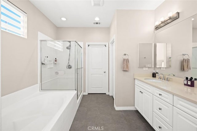 bathroom featuring vanity, tile patterned flooring, and shower with separate bathtub