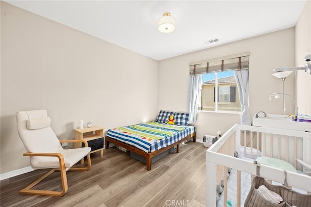 bedroom featuring hardwood / wood-style flooring