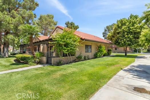 11636 Kerrie Way, Apple Valley, CA 92308 - view of front facade with a front yard and a tiled roof