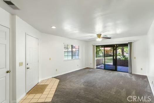 11636 Kerrie Way, Apple Valley, CA 92308 - spare room with carpet floors, a ceiling fan, and baseboards