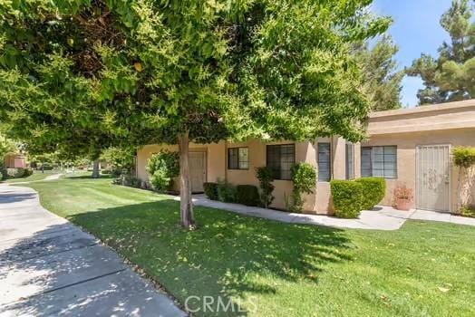 11636 Kerrie Way, Apple Valley, CA 92308 - obstructed view of property with a front yard and stucco siding