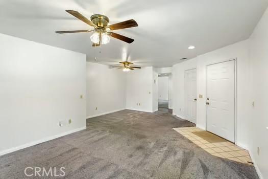 11636 Kerrie Way, Apple Valley, CA 92308 - unfurnished living room with carpet, a ceiling fan, baseboards, and recessed lighting