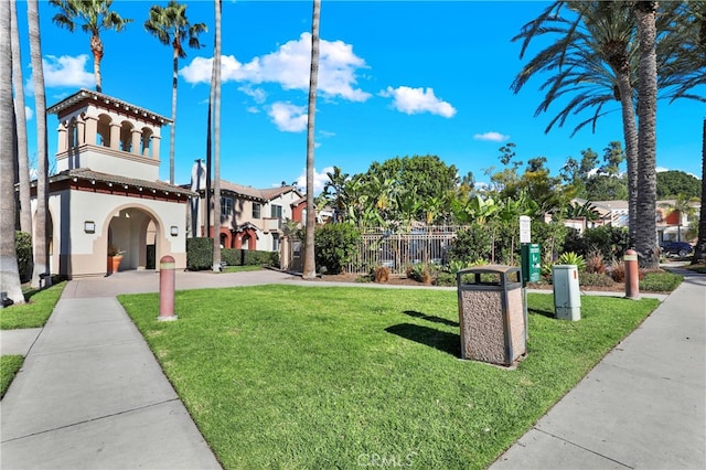 view of property's community with a lawn