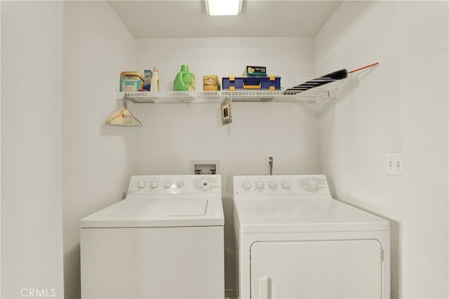 laundry room featuring washing machine and dryer