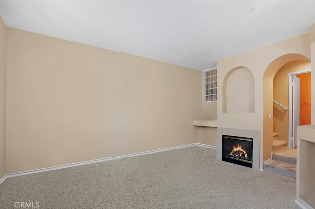 unfurnished living room with carpet