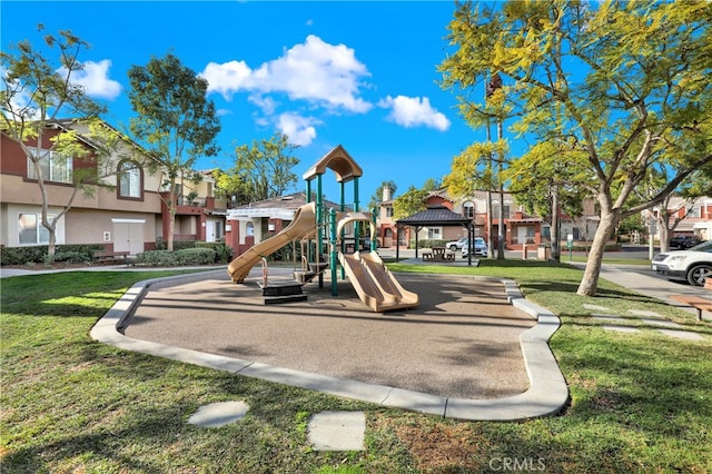 view of jungle gym featuring a gazebo and a lawn