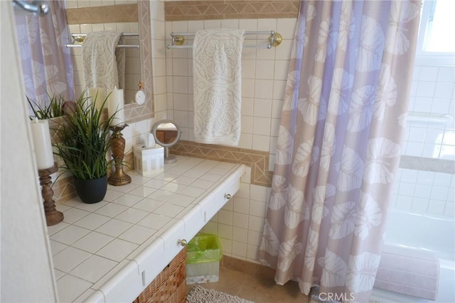 bathroom featuring tile patterned flooring and shower / bath combo with shower curtain