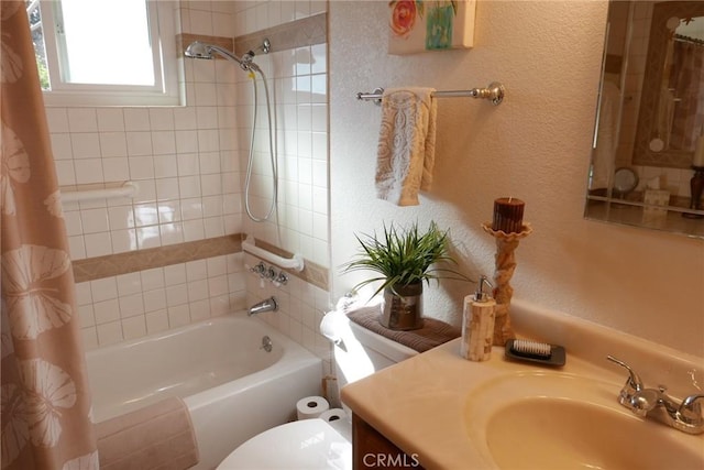 full bathroom with vanity, shower / tub combo with curtain, and toilet