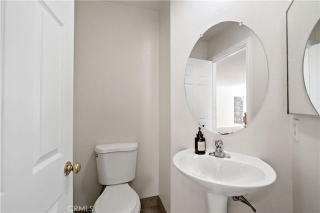 bathroom with sink and toilet