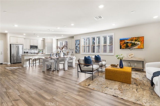 living room with light hardwood / wood-style floors