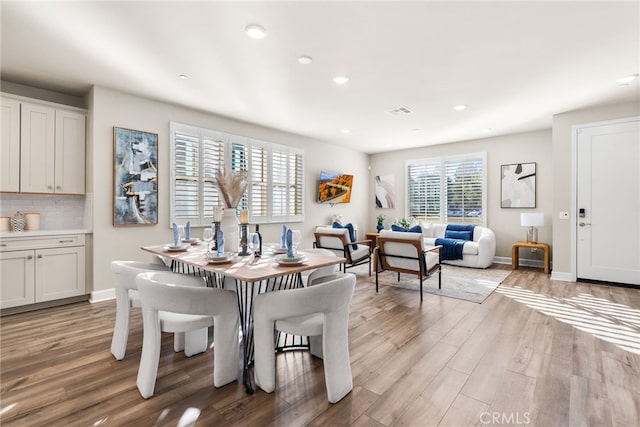 dining space featuring light hardwood / wood-style floors