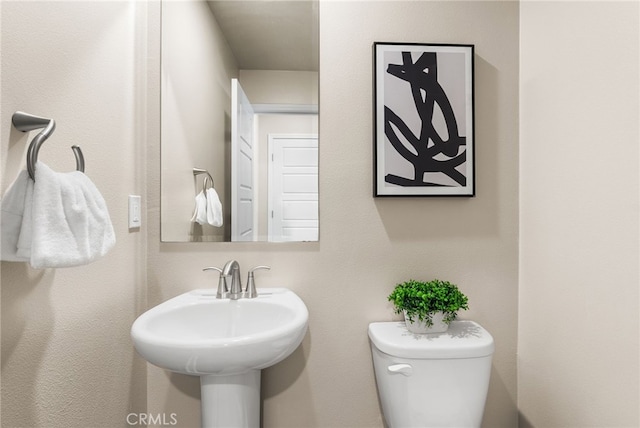 bathroom with sink and toilet