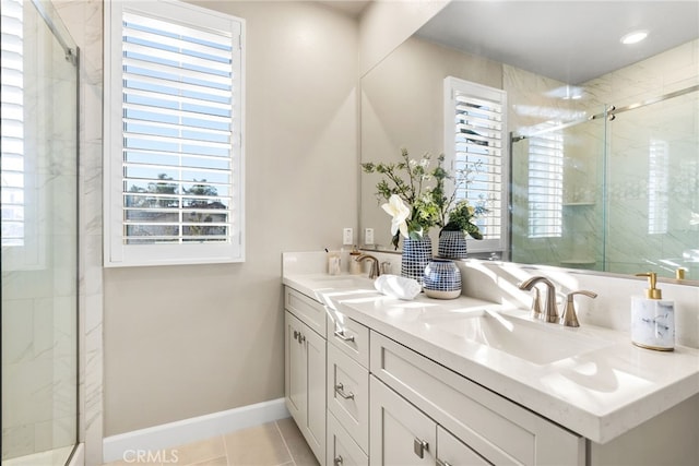 bathroom featuring vanity, tile patterned floors, and a shower with door