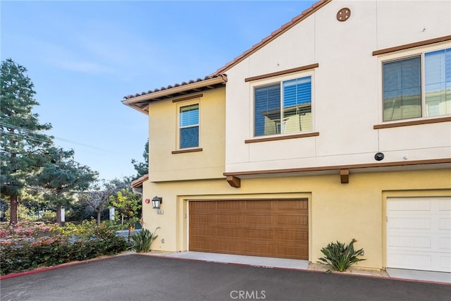 view of property exterior featuring a garage