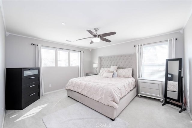 bedroom featuring ceiling fan, carpet, and crown molding