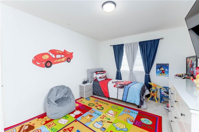 bedroom with light colored carpet