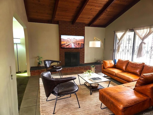 living room featuring a brick fireplace, tile patterned flooring, wood ceiling, and vaulted ceiling with beams