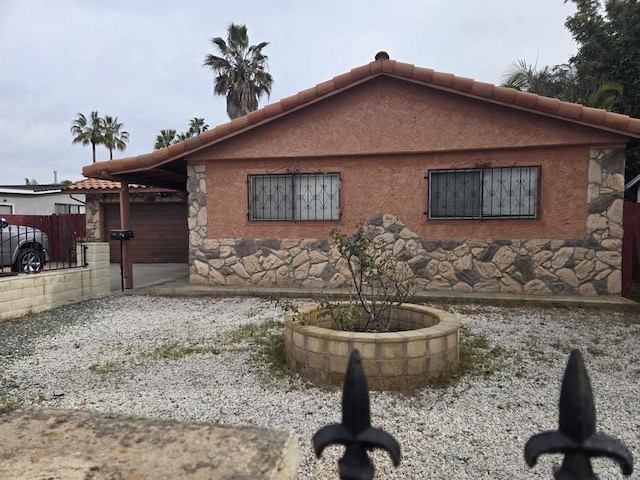 view of side of home with a garage