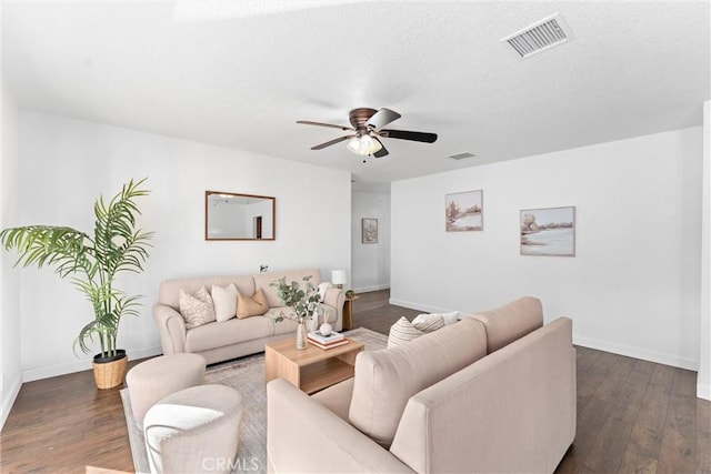 living room featuring dark hardwood / wood-style floors and ceiling fan