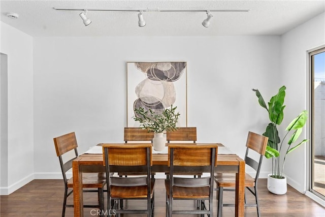 dining space featuring dark hardwood / wood-style flooring