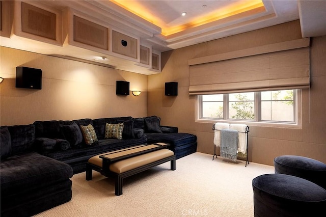 interior space featuring a tray ceiling and carpet flooring