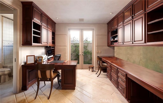 home office with french doors and built in desk