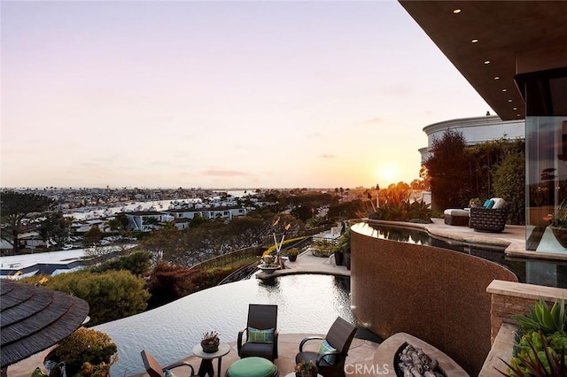 view of balcony at dusk