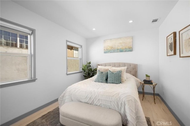 bedroom with hardwood / wood-style floors