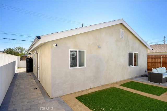 rear view of house featuring an outdoor hangout area and a patio area