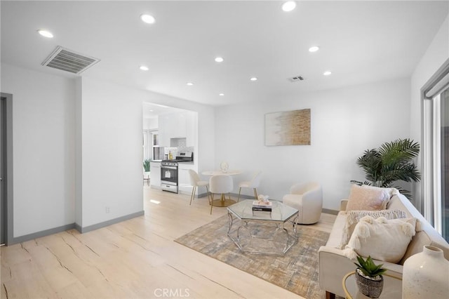 living room with light hardwood / wood-style floors