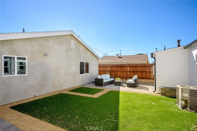 view of yard featuring outdoor lounge area, cooling unit, and a patio