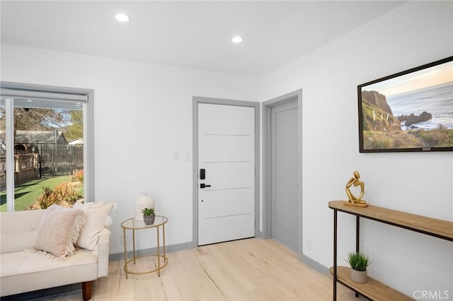 foyer entrance with light hardwood / wood-style floors