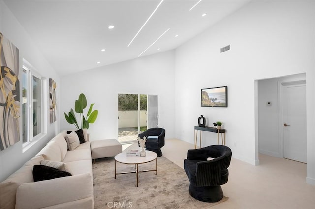 living room with high vaulted ceiling