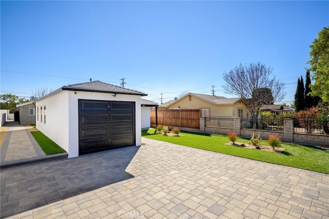 garage featuring a lawn