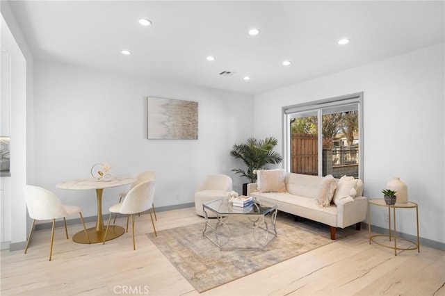 living room with light hardwood / wood-style floors