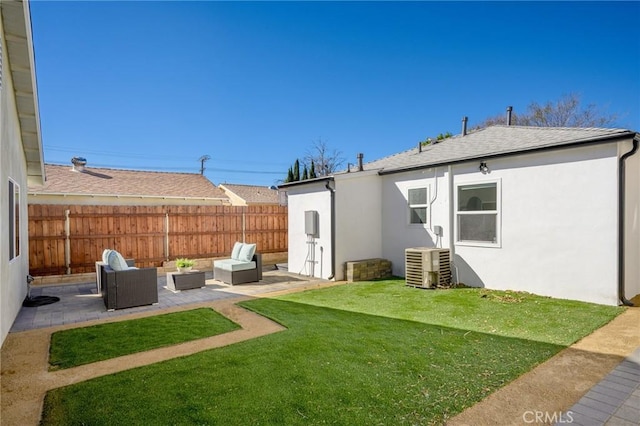 back of property featuring a patio area, central AC unit, an outdoor living space, and a lawn