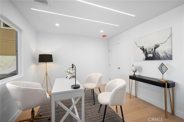 office space with light wood-type flooring