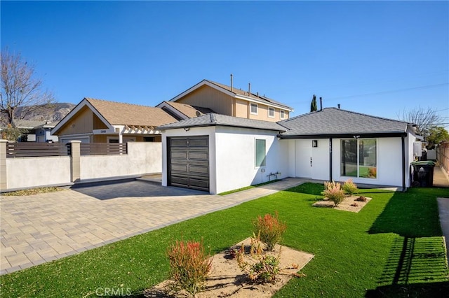 exterior space featuring a front lawn and a garage